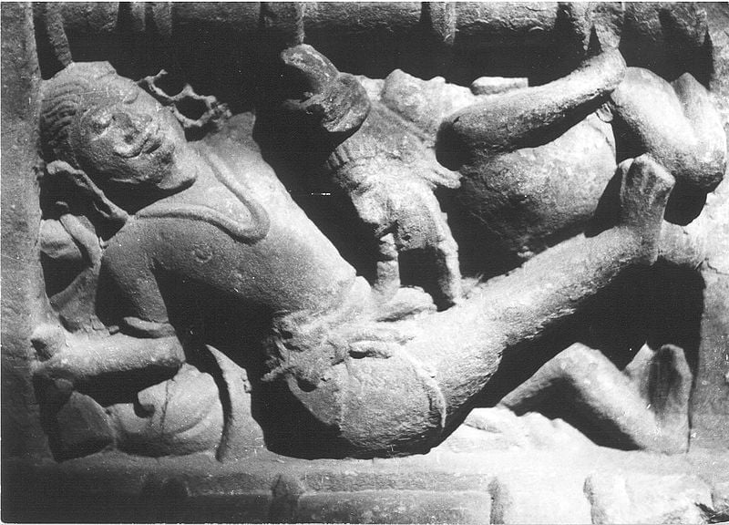 At the Lakshmana temple in Khajuraho (954 CE), a man receives fellatio from a seated male as part of an orgiastic scene