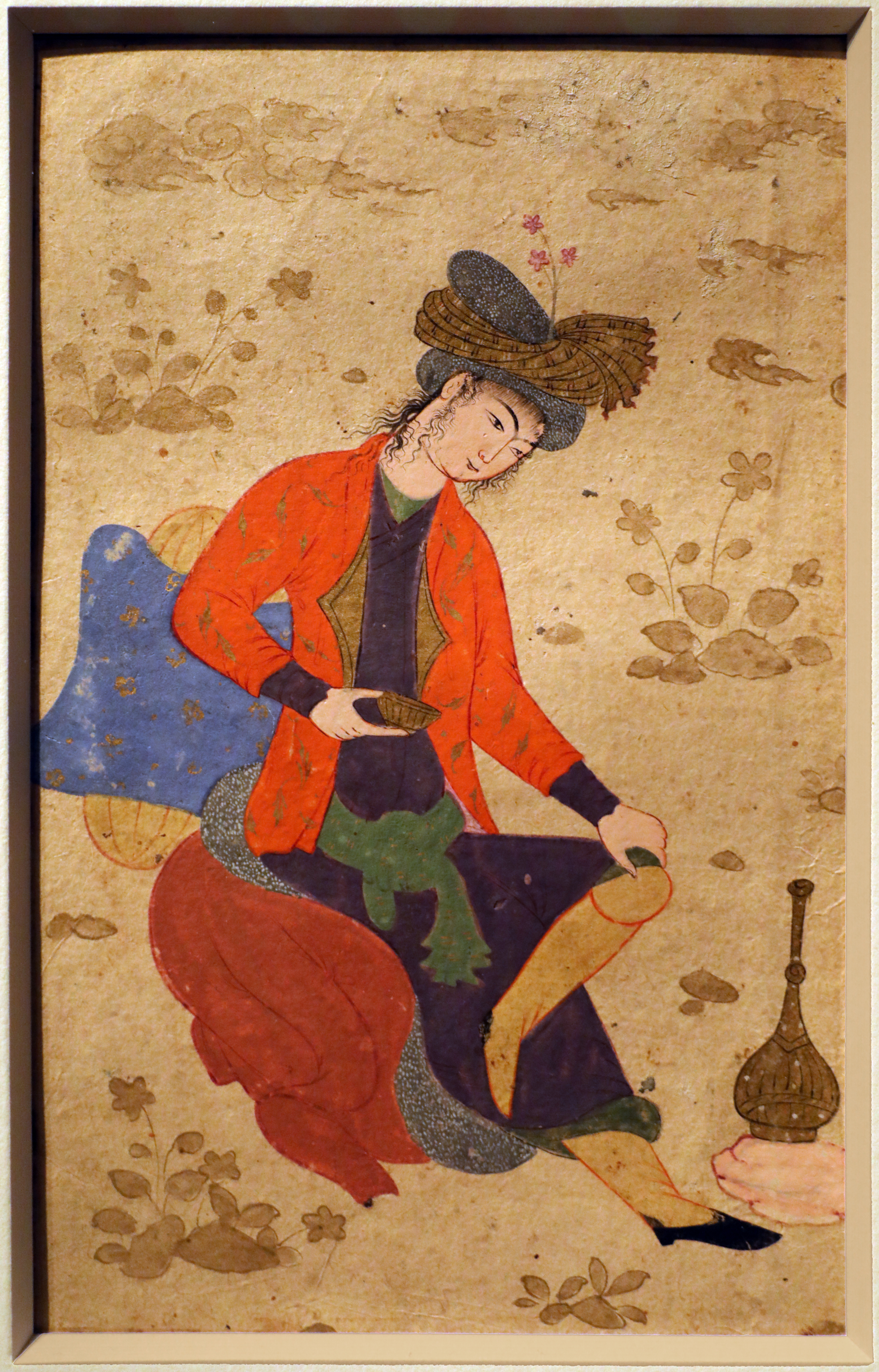 Iran, giovane seduto con cuscino e tazza, isfahan 1600-33 ca